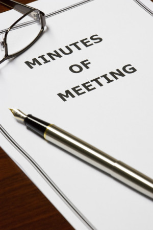 meeting minutes with pen