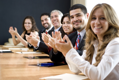 people applauding at a happy meeting