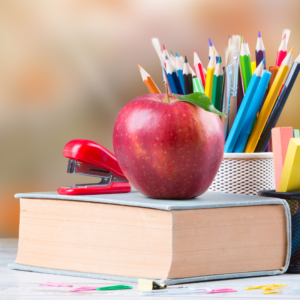 book apple pencils indicating school board responsibilities